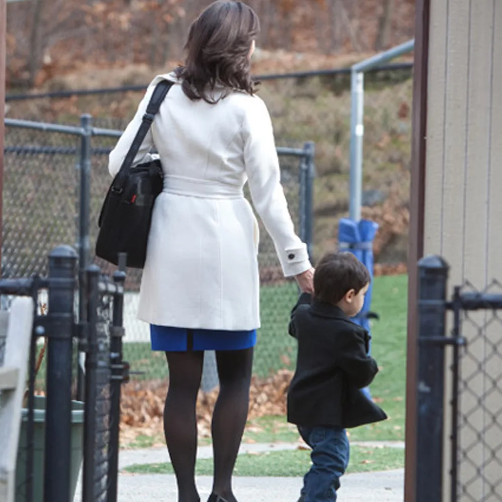 A child being dropped off at Little Newtons daycare by his mother