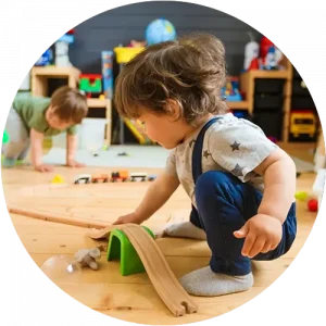 A child using a ramp toy to play at a Little Newtons daycare