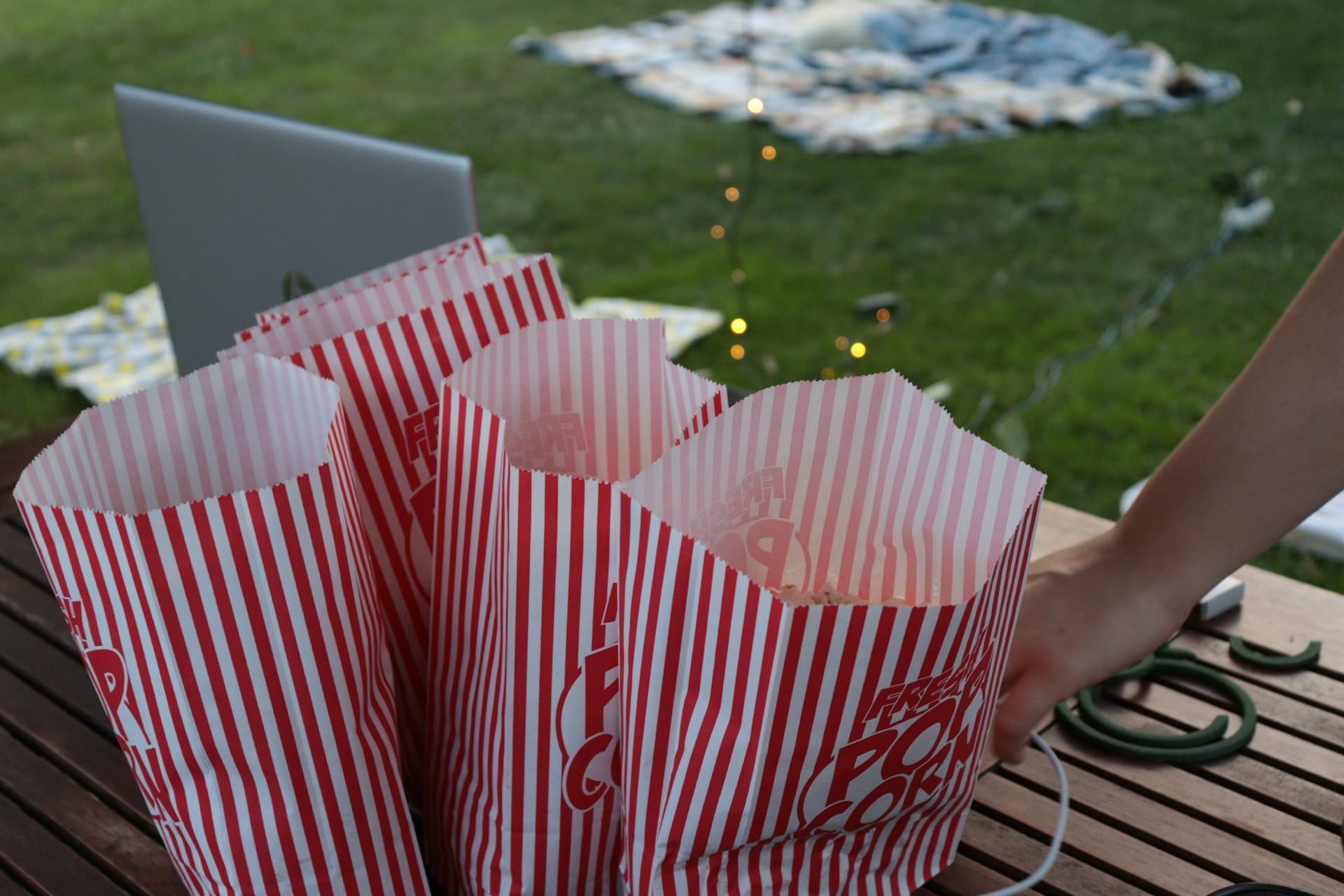 Popcorn on a picnic blanket for an outdoor movie