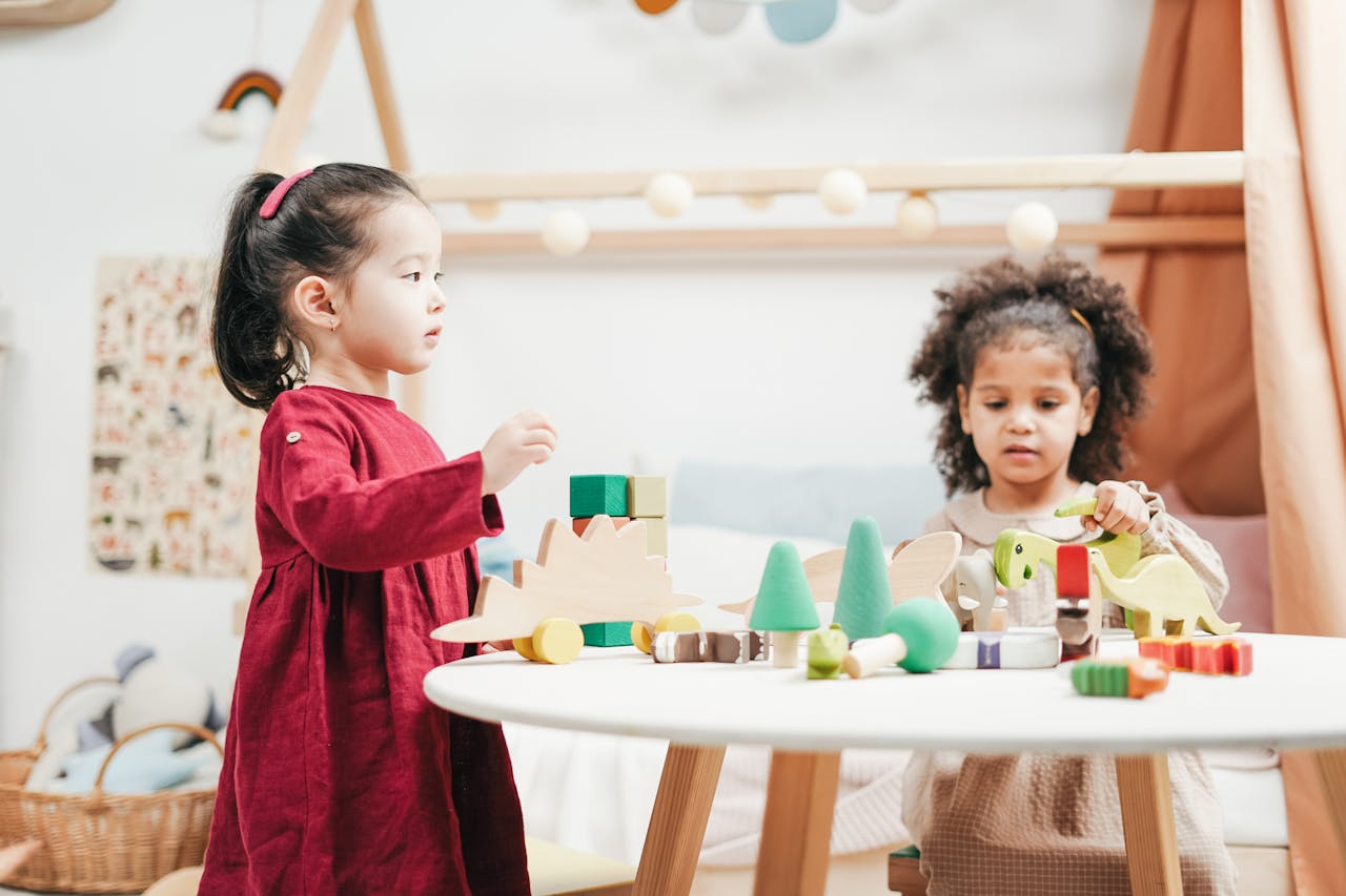 Two children playing with blocks at a Little Newtons daycare.