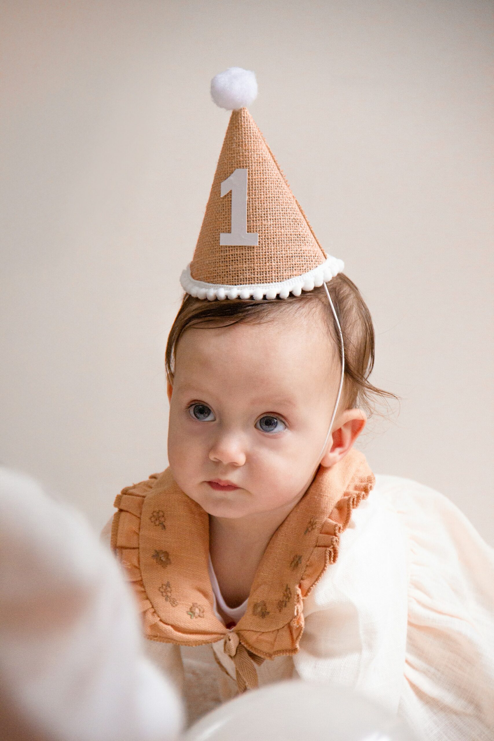 Baby with a birthday hat